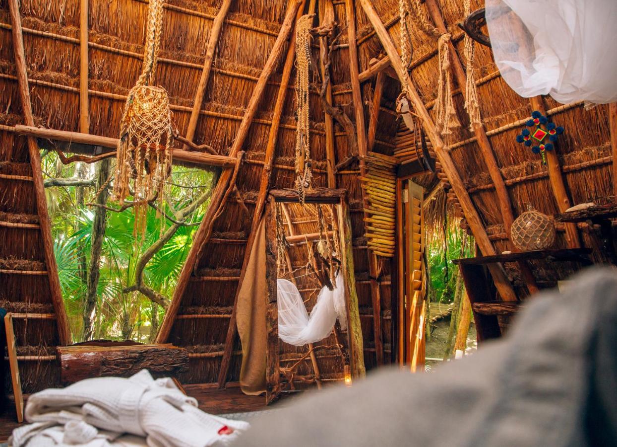 Ikal Tulum Hotel Exterior photo Interior of a hut at the resort
